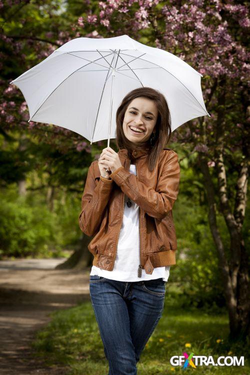 Women And Umbrella - Shutterstock 200xjpg