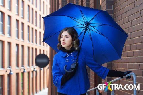 Women And Umbrella - Shutterstock 200xjpg