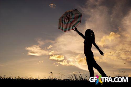 Women And Umbrella - Shutterstock 200xjpg