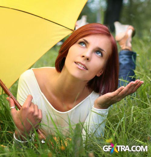 Women And Umbrella - Shutterstock 200xjpg