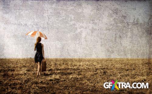 Women And Umbrella - Shutterstock 200xjpg