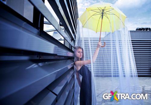 Women And Umbrella - Shutterstock 200xjpg