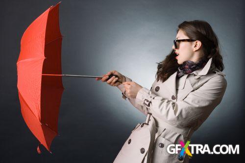 Women And Umbrella - Shutterstock 200xjpg