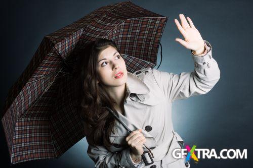 Women And Umbrella - Shutterstock 200xjpg