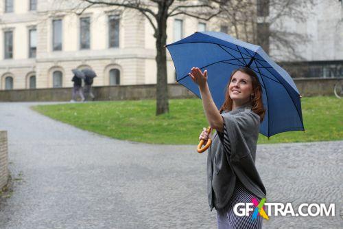 Women And Umbrella - Shutterstock 200xjpg