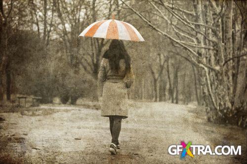 Women And Umbrella - Shutterstock 200xjpg