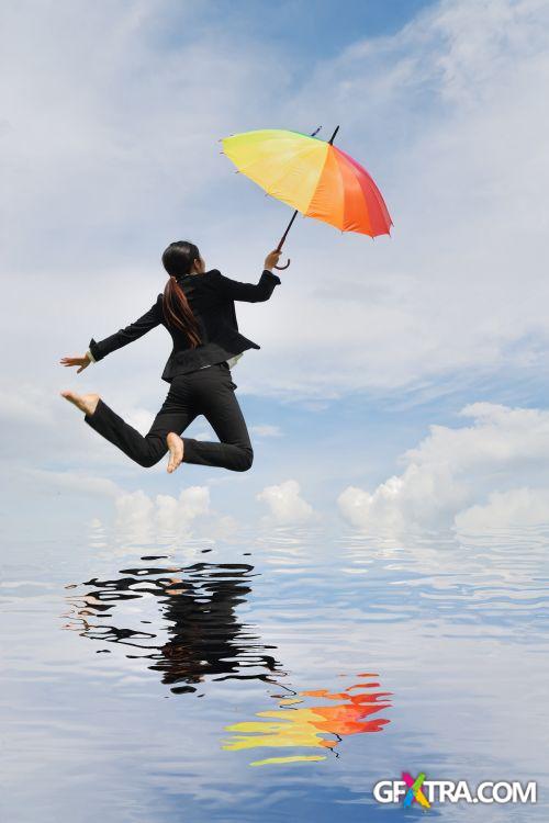 Women And Umbrella - Shutterstock 200xjpg