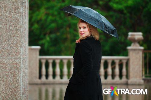 Women And Umbrella - Shutterstock 200xjpg