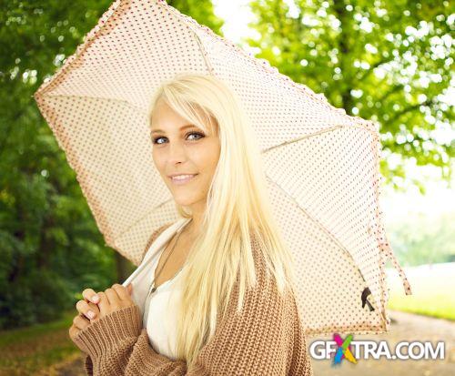 Women And Umbrella - Shutterstock 200xjpg