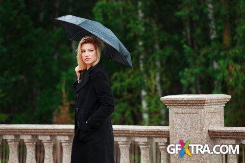 Women And Umbrella - Shutterstock 200xjpg