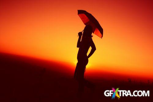 Women And Umbrella - Shutterstock 200xjpg