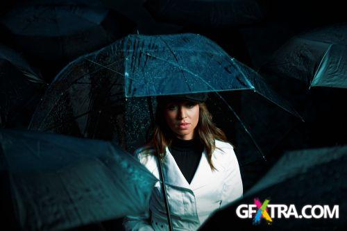 Women And Umbrella - Shutterstock 200xjpg