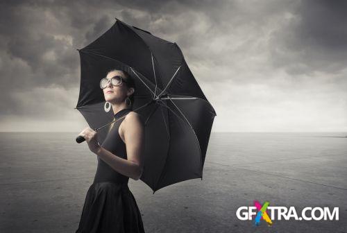 Women And Umbrella - Shutterstock 200xjpg