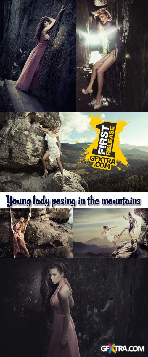 Stock Photo: Young lady posing in the mountains