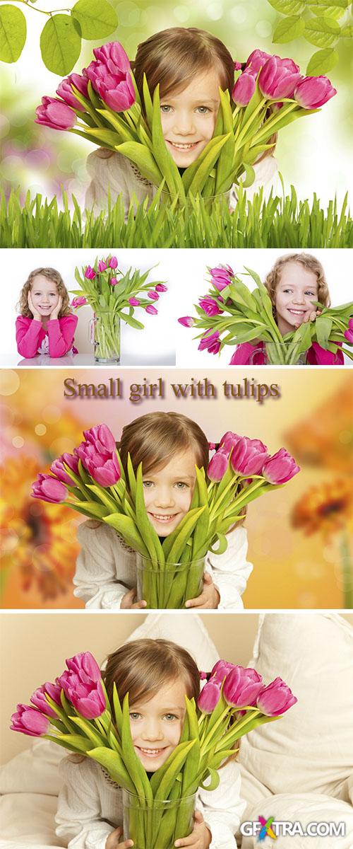 Stock Photo: Small girl with tulips