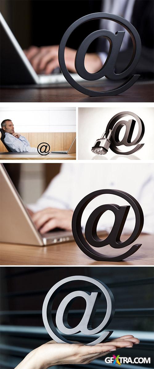 Stock Photo: At symbol with business person on laptop