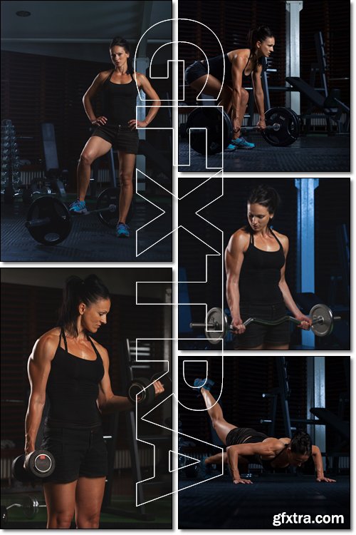 Beautiful Fitness Woman working out in the gym - Stock photo