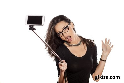 Stock Photos - Pretty Brunette Making Selfie with a Stick