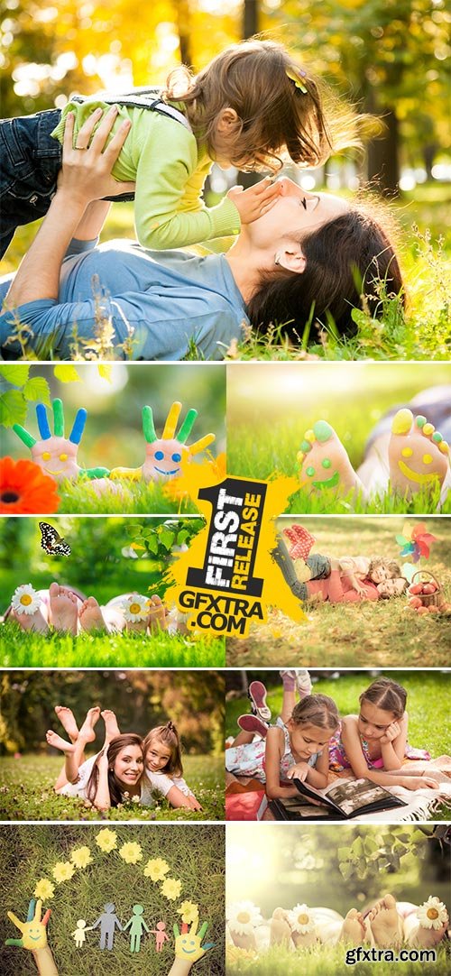 Stock Photo: Happy family lying on green grass