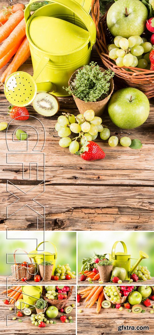 Stock Photos - Garden Concept, Fresh Fruits And Vegetables On Wooden Table, Watering Can, Seeds, Plants