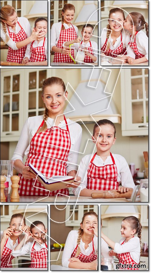 Mom and daughter in the kitchen preparing goodies - Stock photo