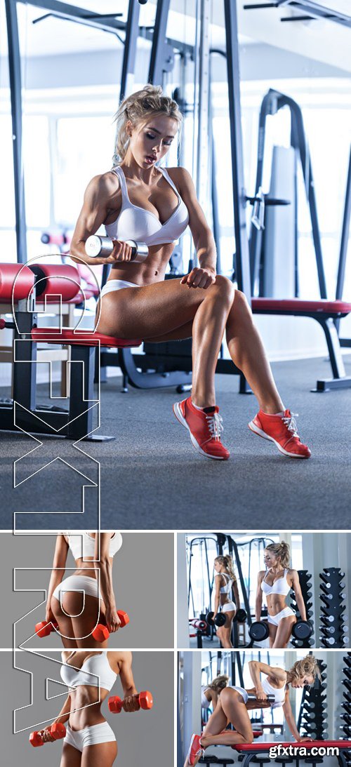 Stock Photos - Sportive Young Woman Doing Exercise With Barbell In The Gym