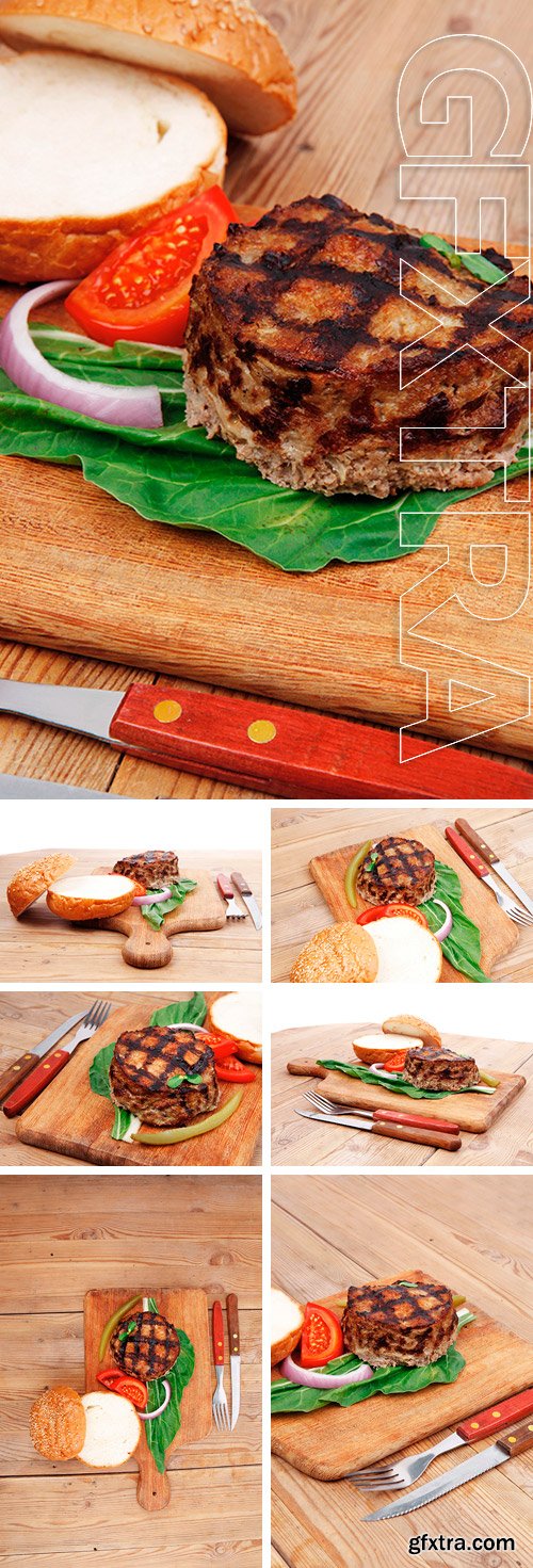 Stock Photos - Extra thick hot beef meat hamburger lunch on wooden plate with tomatoes and salad  and fresh sweet bun