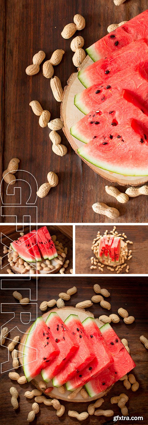 Stock Photos - Ripe red watermelon with peanuts on wooden background