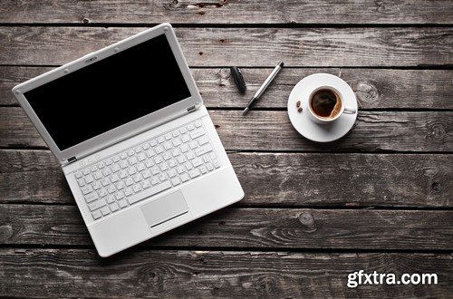 The laptop on a wooden table