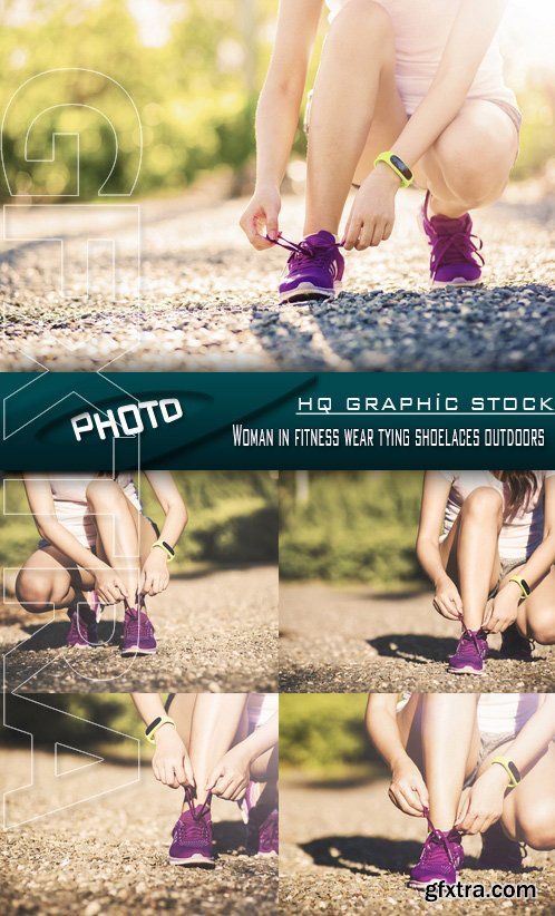 Stock Photo - Woman in fitness wear tying shoelaces outdoors