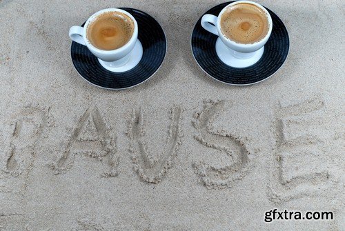 Cup of coffee on the sand