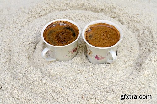 Cup of coffee on the sand