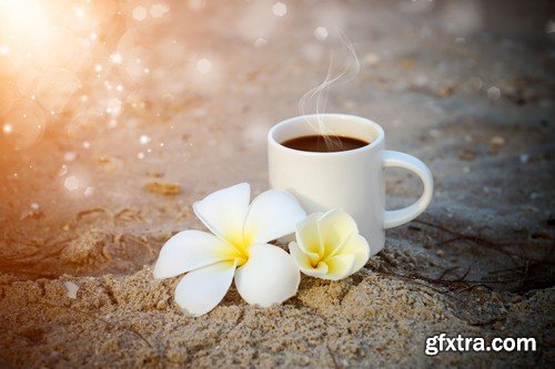 Cup of coffee on the sand