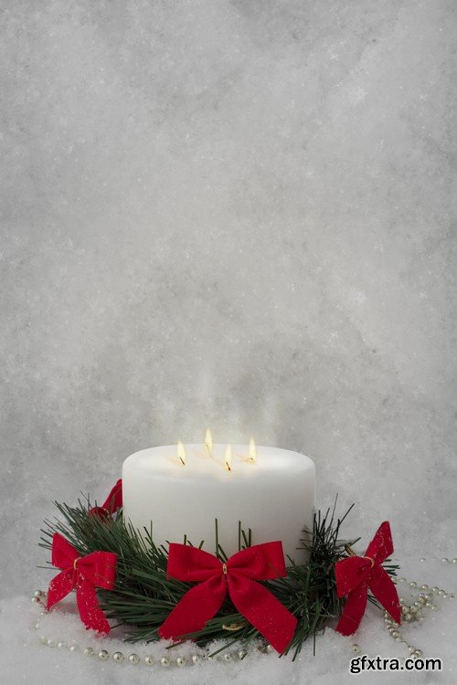 Christmas candle on snow