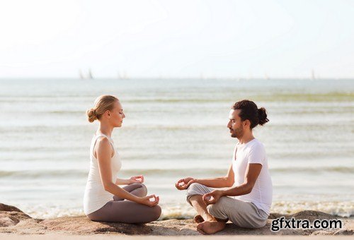 woman practicing yoga at seashore 7X JPEG