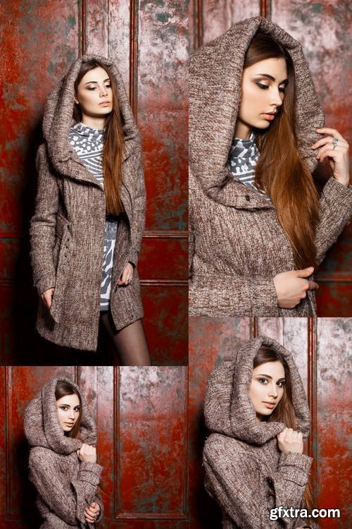 Fashionable Stylish Young Girl in Jacket with Hood Standing Near Red Vintage Wall