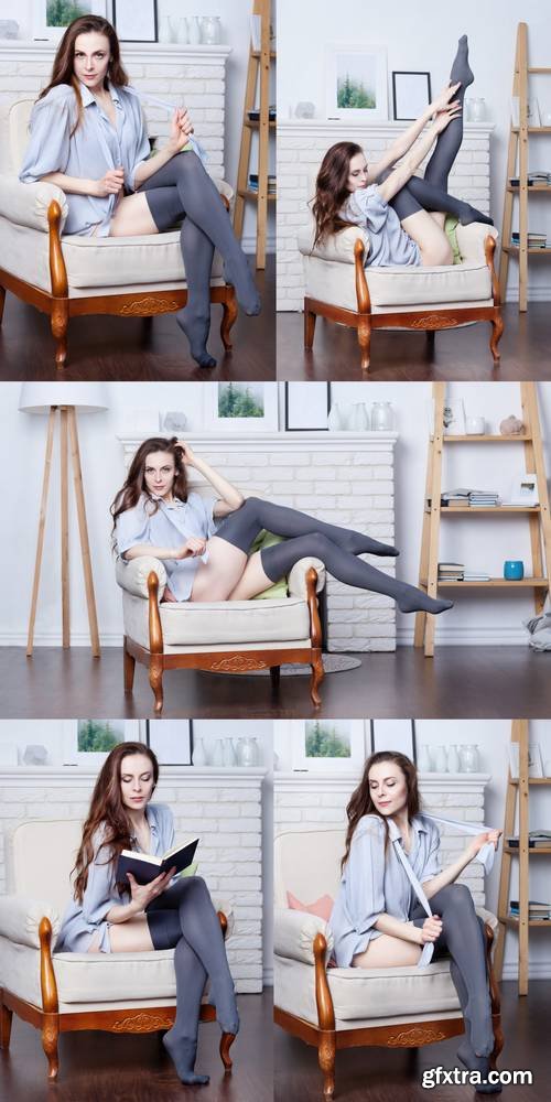 Attractive Young Slim Brunette is Sitting in a Big Comfortable Chair