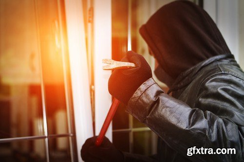 Burglar breaking in a house 7X JPEG