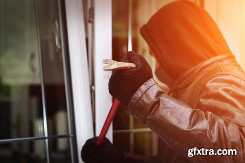 Burglar breaking in a house 7X JPEG