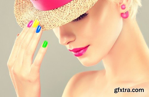 Stylish blonde girl with bright makeup and colorful nail