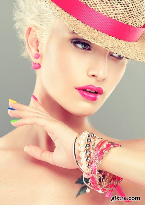 Stylish blonde girl with bright makeup and colorful nail