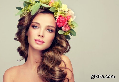 Beautiful woman model brunette with long curly hair floral wreath on the head