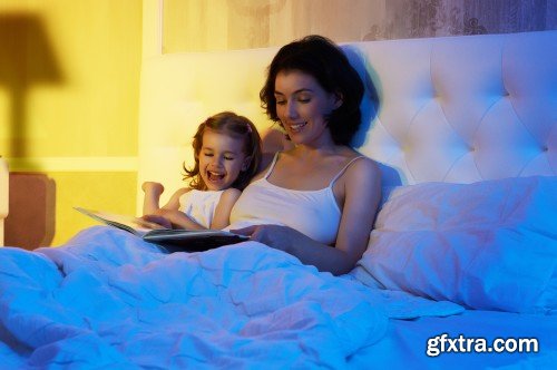 Mother reading a book, girl sleeping in the bed, nightmare for children