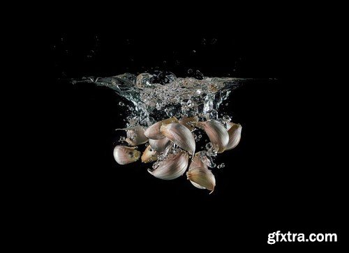 Vegetables in water on black background-9xUHQ JPEG