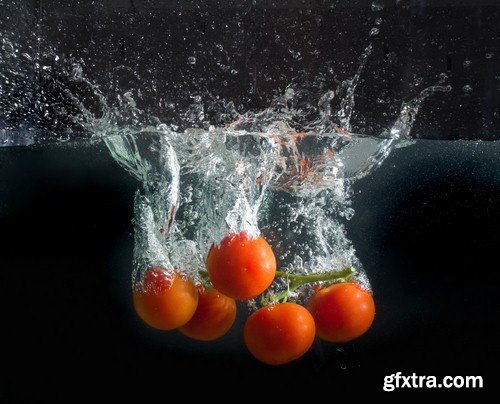 Vegetables in water on black background-9xUHQ JPEG