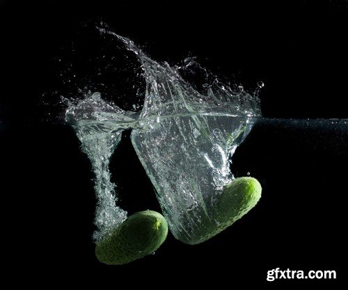 Vegetables in water on black background-9xUHQ JPEG