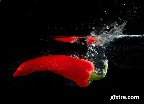 Vegetables in water on black background-9xUHQ JPEG