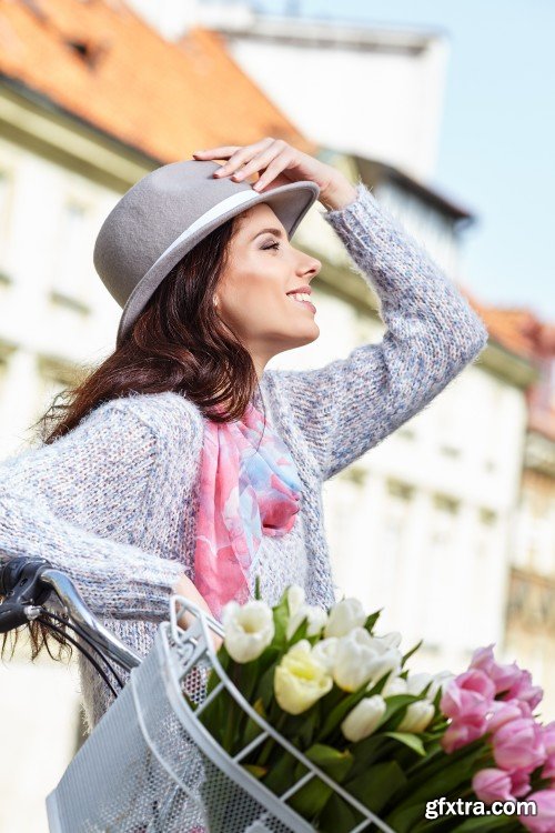 Girl on bike with tulips