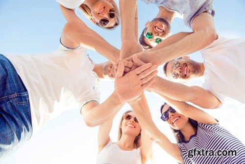 Group of diverse successful young  boyfriends and girlfriends having fun at summertime