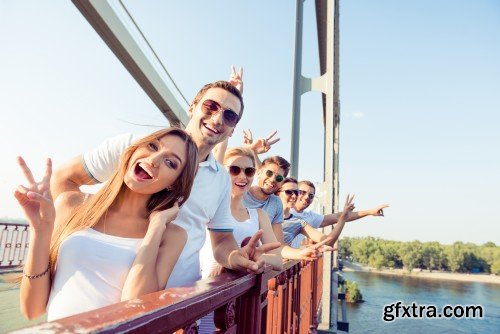 Group of diverse successful young  boyfriends and girlfriends having fun at summertime